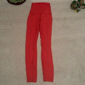 Neon pinkish red lululemon leggings